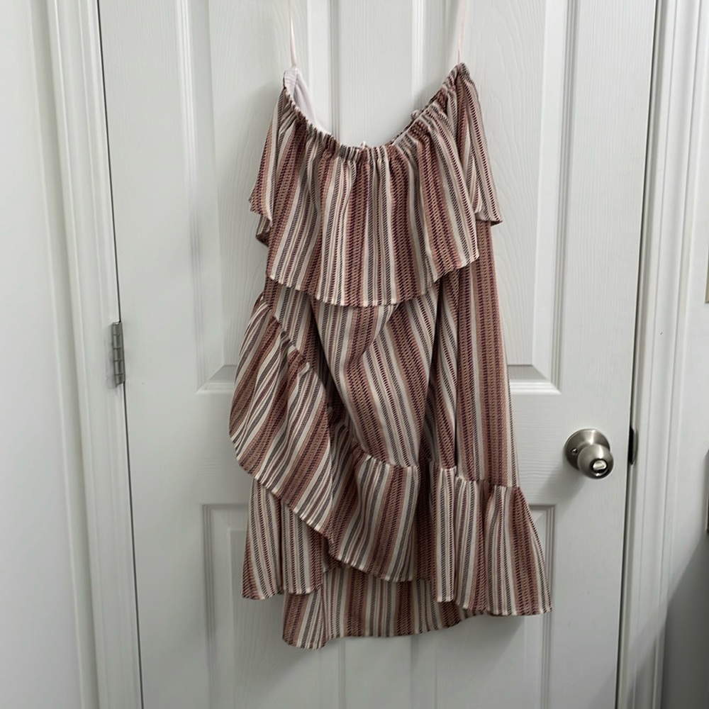 Cute, flouncey sun dress with soft ruffle detailing.